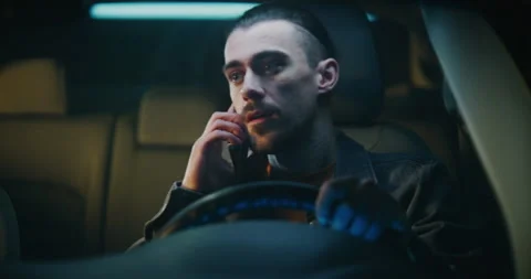 Guy Gets in Car Irritated While Continuing Unpleasant Phone Conversation on Stock Footage 329388548