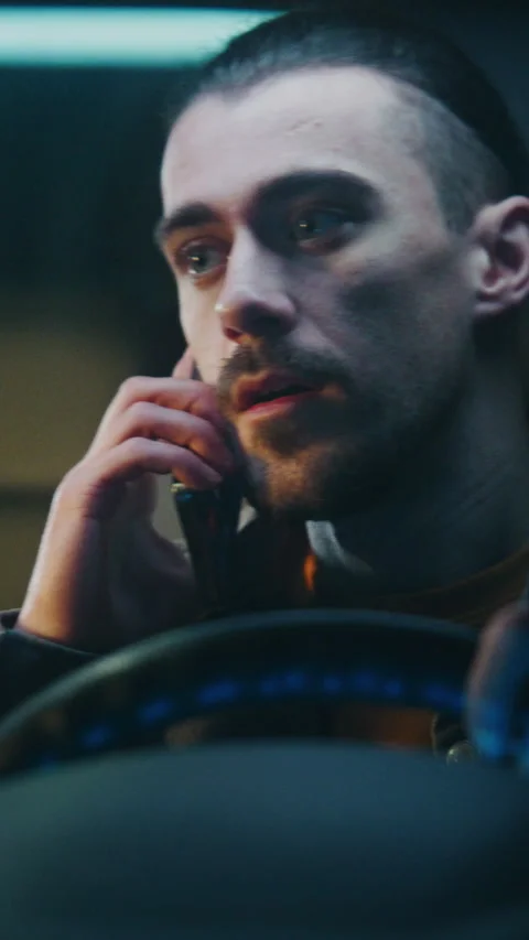 Guy Gets in Car Irritated While Continuing Unpleasant Phone Conversation on Stock Footage 329388801
