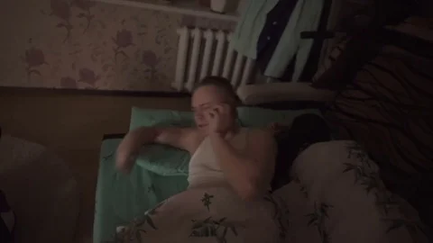 Guy gets out of bed and dressed Stock Footage 81388513