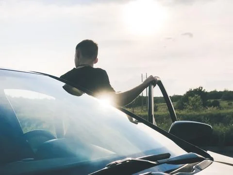 The guy gets out of the car Stock Photos