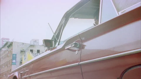 A guy gets into a Red Thunderbird Stock Footage 273401873