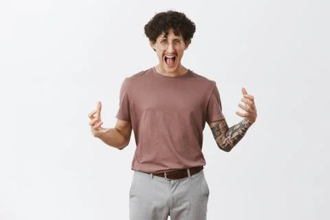 Guy getting pissed off on work. Fed up stylish creative male designer in fury Foto stock