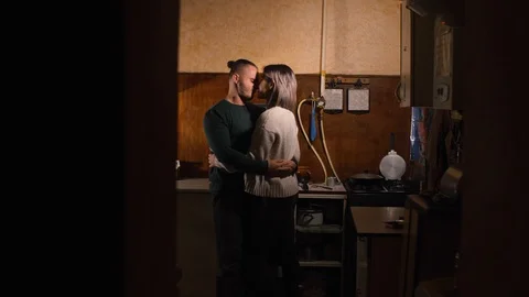 Guy with a girl in the kitchen Stock Footage 97853666