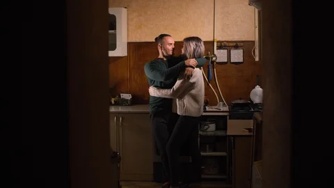 Guy with a girl in the kitchen Stock Footage 97853729
