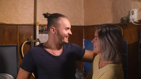 Guy with a girl in the kitchen Stock Footage 98009586