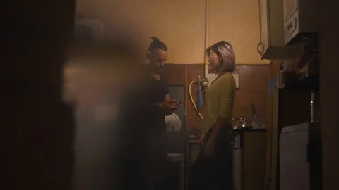 Guy girl kitchen Stock Footage 98557781