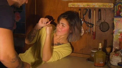 Guy with a girl in the kitchen Video stock 98902777
