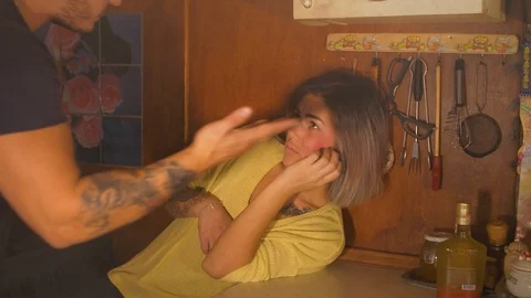 Guy with a girl in the kitchen Video stock 98902818