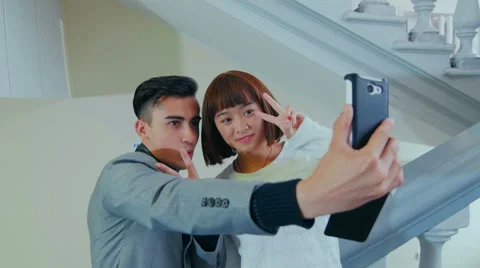 The guy with the girl on the phone doing SELF 스톡 동영상 59081967