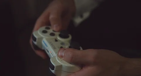 Guy with a girl playing in the console Stock Footage 117940293