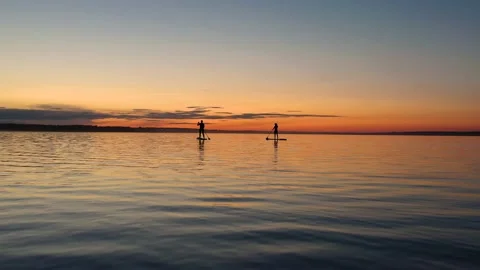 Guy with girl on the sunset float on the SAP Board Stock Footage 130558891