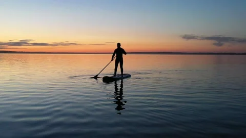 Guy with girl on the sunset float on the SAP Board Stock Footage 130559630