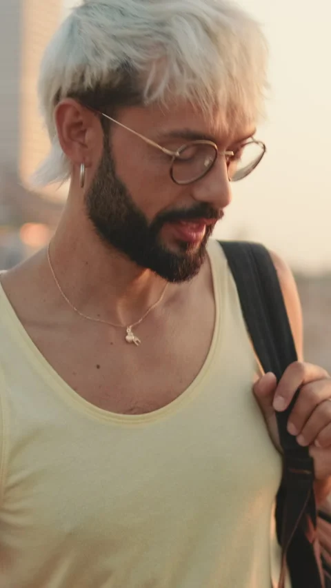 Guy with glasses with beard and white hair is talking to someone Stock Footage 253927417