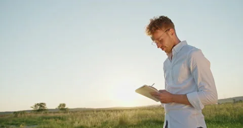 The guy in glasses classically dressed artist romantic artist dreamily inspired Stock Footage 142256274