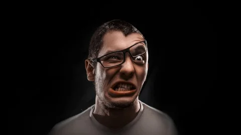 The guy with the glasses contorts funny faces Stock Footage 87219805