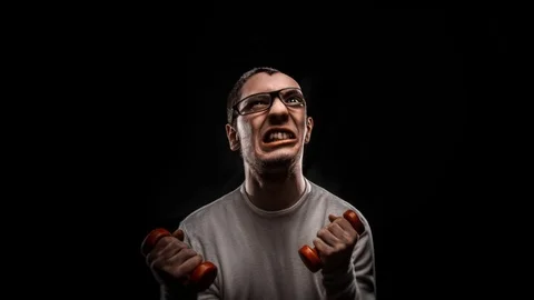 The guy with the glasses contorts funny faces Stock Footage 87219806