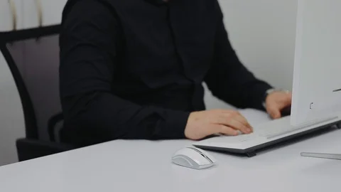 The guy with glasses learns lessons on the home computer Stock Footage 106498456