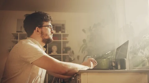 The guy with glasses on an online interview. He is talking looking into a Stock Footage 129962983