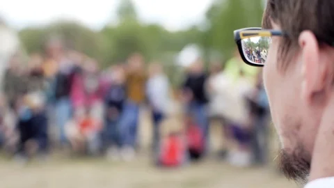 Guy with glasses watching a show at the event Video stock 104027851
