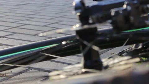 The guy goes to the bike. Evening time. Brightly dressed 動画素材 130740832