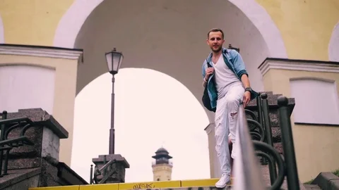 A guy goes down on the handrail Stock Footage 71229672