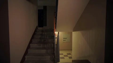 Guy goes down the stairs Stock Footage 79674339