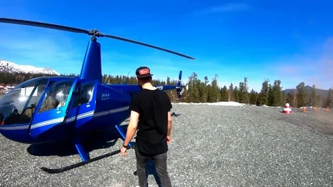 The guy goes to the helicopter. Slow Motion Stock Footage 107593490