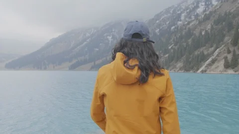 The guy goes to the mountain lake Stock Footage 107813135