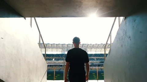 Guy goes to the podium of the stadium Stock Footage 118579028