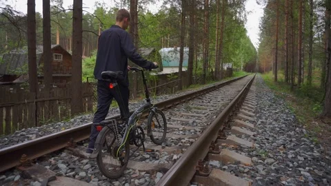 The guy goes on rails with a bicycle. Stock Footage 93975476