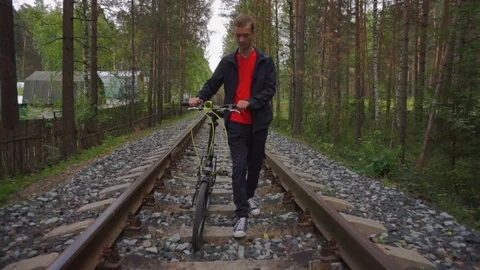 The guy goes on rails with a bicycle. Stock Footage 93975495
