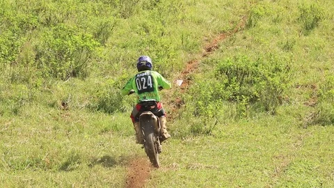 A guy going up a really steep hill Stock Footage 89719494
