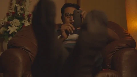 Guy going through his cellphone Stock Footage