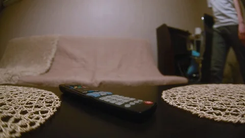 The guy is going to watch TV. close up Stock Footage 87403783