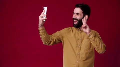 The guy got a video call, he is very happy about it Stock Footage 165620840