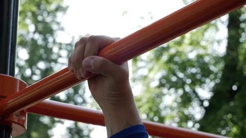 The guy grabs the horizontal bar. Stock Footage 150580846
