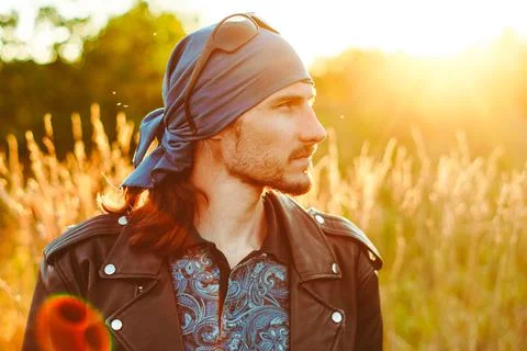 The guy in the grass at sunset Stock Photos