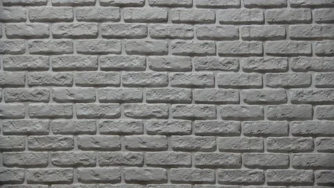 The guy in the green jacket comes out on the right, looks at the ground Video stock 131169516