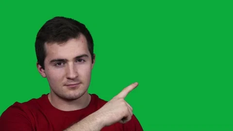 Guy on the green screen points his finger to the side Video stock 158817996