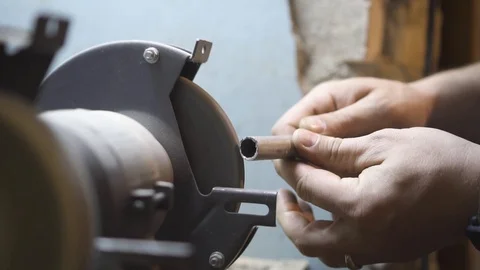 The guy grinds metal on the machine Stock Footage 108501139