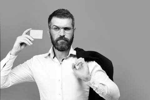 Guy with grumpy face and glasses isolated on blue background 스톡 사진