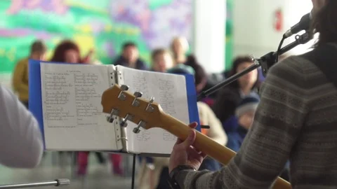 The guy with the guitar singing at the microphone Stock Footage 107122089