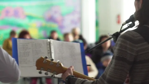 The guy with the guitar singing at the microphone Stock Footage 110842801