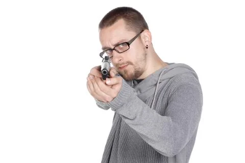 Guy with gun pointed Fotos de archivo