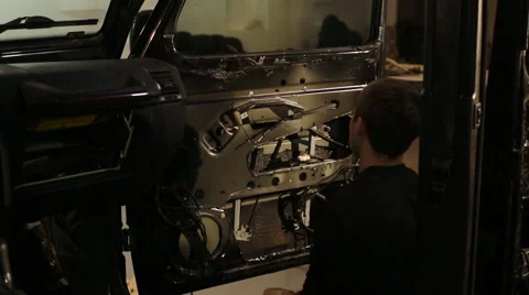 The guy has been soundproof door of the car Stock Footage 56024417