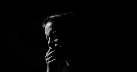 Guy has a headache, rubs his temples, a psychological disorder Video stock 131718458
