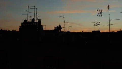 A guy have fun on a rooftop silhouette sunset Stock-Footage 126591667