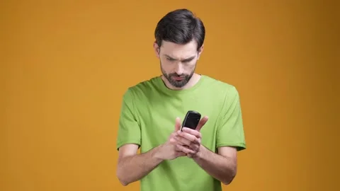 Guy have spare time watch different movies isolated bright color background Video stock 204990691