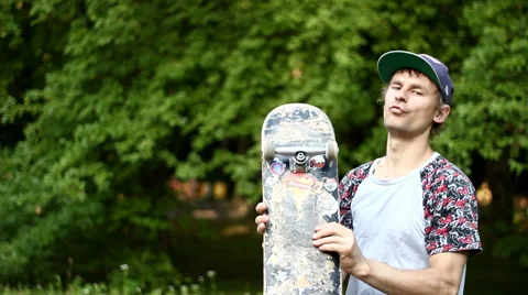 Guy Having Fun with a Skateboard in His Hand Video stock 52195713