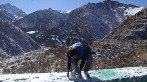 Guy is having fun with the spring snow posing camera in winter beautifull Stock Footage 71771108